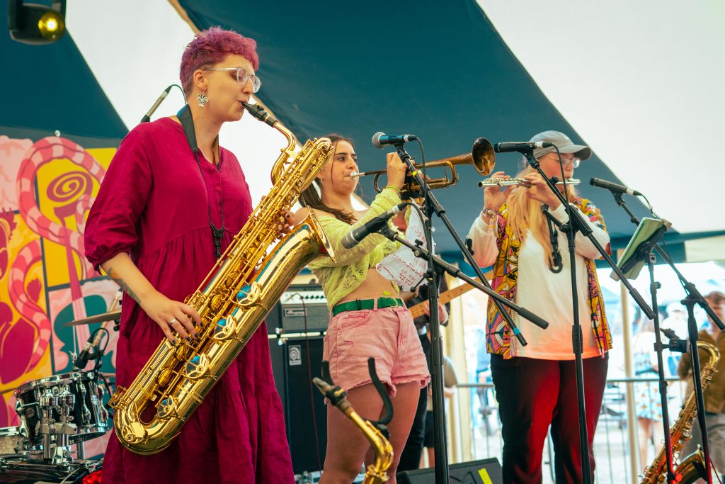 A band performing at a festival